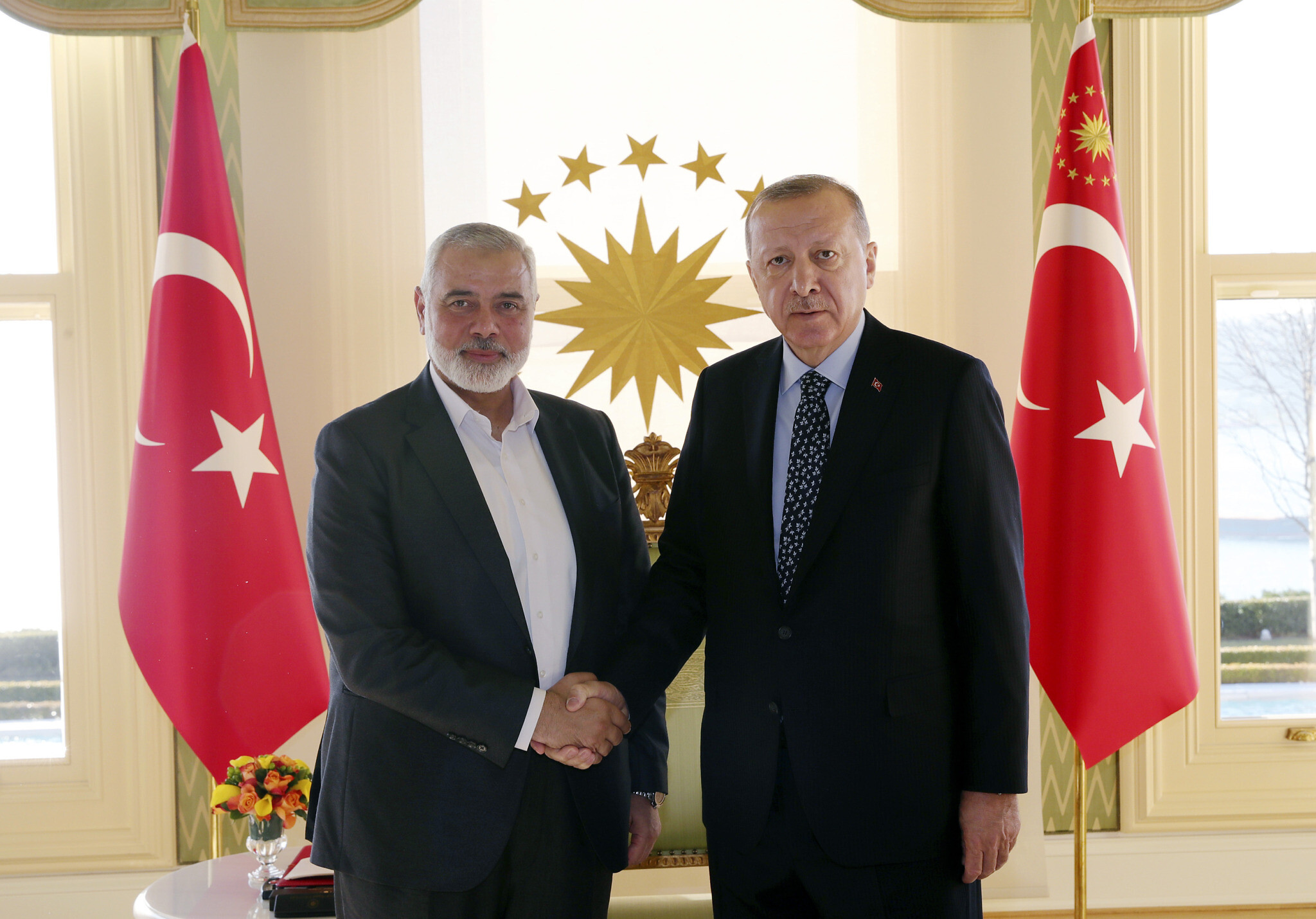 Turkey’s President Recep Tayyip Erdogan, right, shakes hands with Hamas terrorist movement chief Ismail Haniyeh, prior to their meeting in Istanbul, February 1, 2020. (Presidential Press Service via AP, Pool/ File)